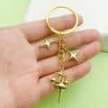 Celestial Charm Keychains Featuring Gold-Tone Stars Across 15 Pictured Variations view 1