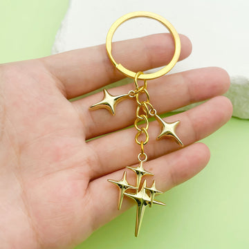 Celestial Charm Keychains Featuring Gold-Tone Stars Across 15 Pictured Variations