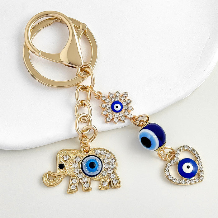 Elephant And Evil Eye Bead Keychain With Rhinestone Charm Cluster