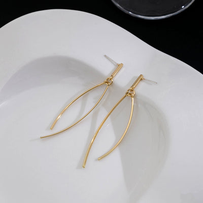 Primary supplied view of crossing wire long earrings