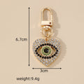 Gold Tone Rhinestone and Faux Pearl Heart Evil Eye Clip Keychains view 4