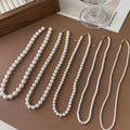 White Faux Pearl Strand Necklace Gold Clasp Six Diameters view 1