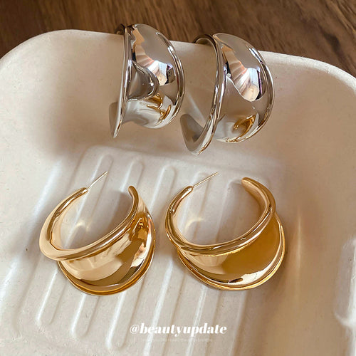 sculptural c hoop stud earrings shown in a clear product view