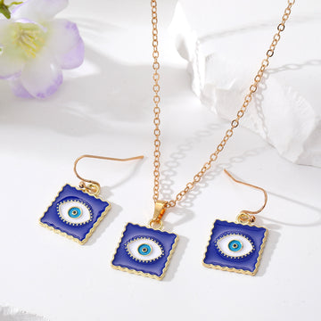 Gold Tone Blue Enamel Evil Eye Necklace and Hook Earring Options