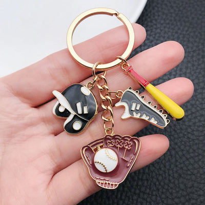 Front product photo of black red and blue baseball charm keychain showing the pictured design arrangement