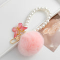 Pink Faux Fur Pom Keychain with Pearl Strand and Glitter Flower Charm view 6
