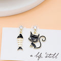 Mismatched Black Cat and Fishbone Gold Tone Dangle Earrings view 3
