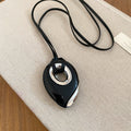 Black Cord Necklace With Layered Teardrop Pendant in Red and Black view 6
