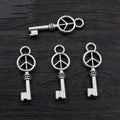 Peace Sign Key Charms in Two Antique Metal Finishes view 7