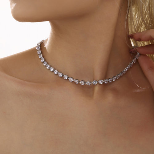 Neckline view of zircon tennis necklace and bracelet collection in main image 2.