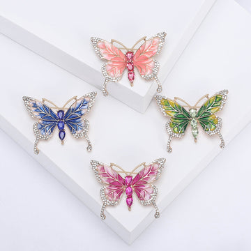 Enamel Butterfly Brooch With Polished Metal And Sculpted Decorative Details