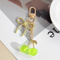 Resin Cherry Pair Charm Keychain with Gold Tone Hardware Accents view 8