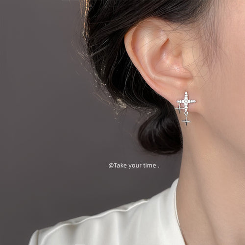 Model wearing silver pave starburst double star stud earring