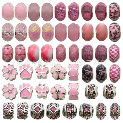 Pink bead beads arranged on a light background