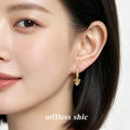 Gold Tone Crystal Pave Huggie Hoop Earrings Bow Drop view 2