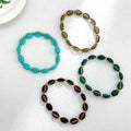 Oval Glass Bead Stretch Bracelet with Gold-Tone Spacers view 1