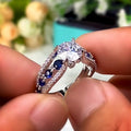 Round Clear Solitaire Split Band Ring With Blue Side Stones view 4