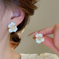 White Petal Flower Stud Earrings with Gold Tone Centers view 1
