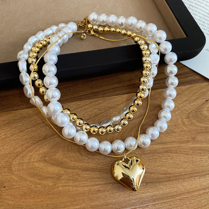 Layered Pearl Heart Pendant Necklace with Distinctive Textured Details