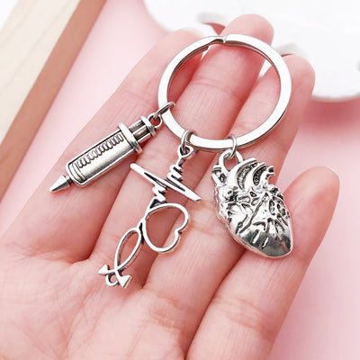 Image 1 showing stethoscope and syringe keychains shown in the product image.
