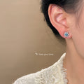 Silver Tone Blue Round Stone And Clear Snowflake Stud Earrings view 2