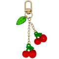 Strawberry Charm Keychains Featuring Magenta Strawberry Across 15 Pictured Variations view 7