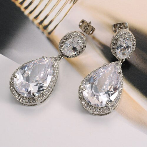 Silver Tone Oval and Teardrop Crystal Earrings angled detail