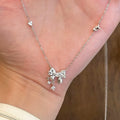 Silver Tone Crystal Bow Pendant Necklace With Dangles view 4