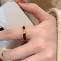Four Mixed Red Enamel And Crystal Open Ring Designs In Gold Tone view 4