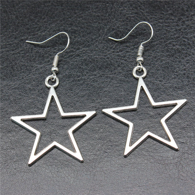 Close-up of open star drop earrings showing open star drops suspended from fishhook ear wires