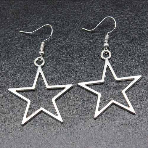 Close-up of open star drop earrings showing open star drops suspended from fishhook ear wires