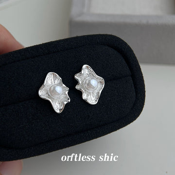 Silver Tone Ruffled Leaf And White Pearl Center Stud Earrings