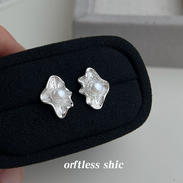 Silver Tone Ruffled Leaf And White Pearl Center Stud Earrings