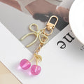Resin Cherry Pair Charm Keychain with Gold Tone Hardware Accents view 9