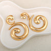 Asymmetric Gold Spirals