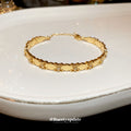 Gold Tone Oval Plate And Tiny Crystal Flower Link Bracelet view 1