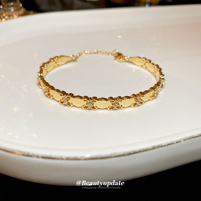 Gold Tone Oval Plate And Tiny Crystal Flower Link Bracelet