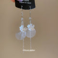 White Floral Disc and Chain Hook Earrings with Polished Metal Details view 2