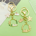 Cat Charm Keychains Featuring White Flower Across 19 Pictured Variations view 2