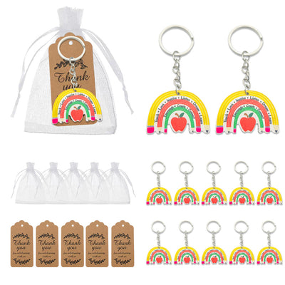 Rainbow and apple keychains shown individually and with white organza bags and printed thank-you tags.