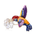 Colorful Hummingbird Brooch Carrying a White Flower view 1