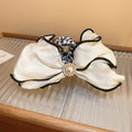 White Satin Bow Hair Claw With Black Piping And Pearl Like Center view 6