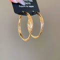Polished Double Hoop Earrings In Gold And Three Silver Sizes view 7