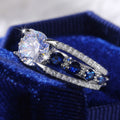 Round Clear Solitaire Split Band Ring With Blue Side Stones view 2