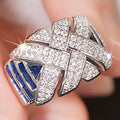 Silver Cross Weave Ring Clear Pave Blue Baguette Stones view 2