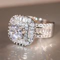 Round Solitaire Baguette Halo Two-Ring Set In Silver Tone view 3