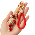 Mixed Red Firecracker Flower Strawberry and Suitcase Fortune Keychains view 5