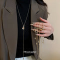 Gold Tone Fine Chain Necklace With Brown Heart Pendant view 1