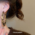 Black and White Wrapped Hoop Earrings with Gold Tone Edges view 3