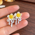 White Floral Dangle Stud Earrings in Two Daisy Styles view 7